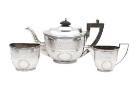 A George VI silver sugar bowl, Edward VII teapot and cream jug