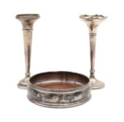 A Millennium silver wine coaster and two bud vases
