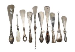 A group of ten Edward VII and later silver shoe horns,