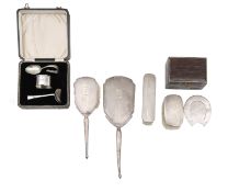 A collection of silver dressing table items and a Christening set