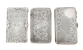 A Victorian and two Edwardian silver cigarette and card cases