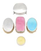A collection of silver and enamelled dressing table items