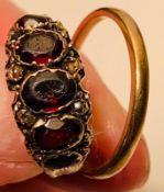 UNMARKED GOLD COLOURED RING SET WITH FOUR AMETHYSTS (RUBBED) AND THREE DIAMOND BRILLIANTS, DAMAGED