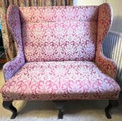 UPHOLSTERED WING SETTEE, APPROX 131cm WIDE, 134cm HIGH AND 65cm DEPTH