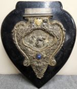 Relating Lot - Silver Plated Repousse Decorated Shield on Ebonised Mount - Presented in 1957 to