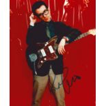 Elvis Costello signed coloured 10x8inch photo.