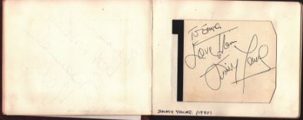 Autograph book. Amongst signatures are Ken Dodd, Jimmy Young, Eric Morecambe, Alvin Stardust, Donald