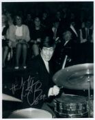 Rolling Stones drummer, the late Charlie Watts signed B&W 8x10 photo of him playing his drums in