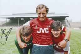 Autographed JOHN LUKIC 12 x 8 Photograph : Arsenal manager Terry Neill poses with new signings -
