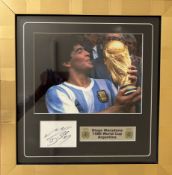 Diego Maradona signed and framed colour photograph from the 1986 World Cup in Mexico.