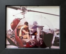 Framed colour photograph of Adam West as Batman and Burt Ward as Robin, inside the Bat copter from