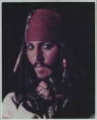 Johnny Depp signed Pirates of the Caribbean 10x8inch colour photo.