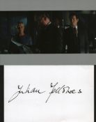 Julian Fellowes signed white card with accompanying photo.