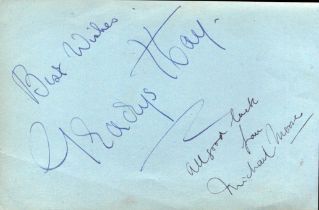 Michael Moore and two others sign large album page