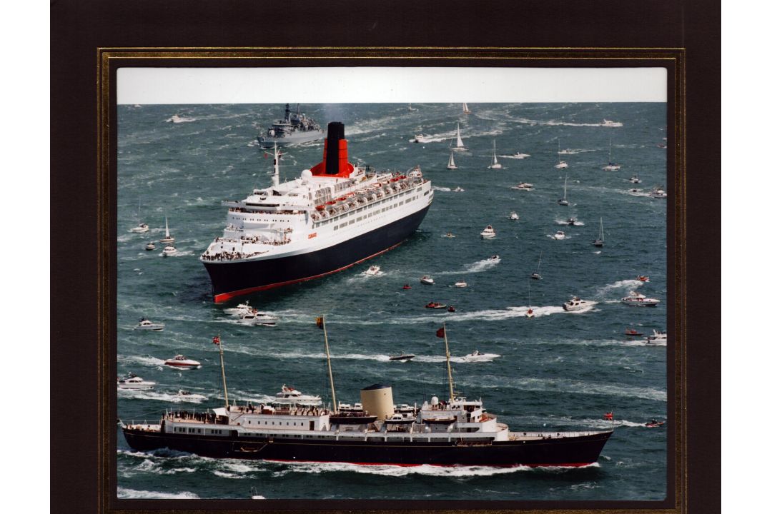 Historic meeting between the Cunard liner RMS Queen Elizabeth 2 (QE2) and the Royal Yacht Britannia.