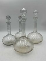 Two pairs of cut glass decanters, 19th century, one bottle size and the other half bottle size