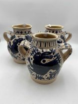 Modern apothecary two handled jars of squat form decorated with prancing hare in deep blue glaze
