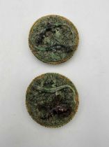 Pair of early 20th century moulded stoneware wall plaques by Caldas, Portugal, one with a pair of