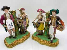 A pair of Victorian Minton figural candle sticks, bother formed as two pairs standing either side of