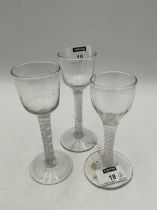 Three George III air twist wine glasses 15, 14.5 and 13.5cm (3)