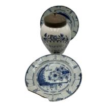 A 19th century Delft globular jar with tin cover, inscription reads 'B-RAPPE' within a foliate