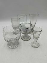 A large collection of tavern glasses together with a trumpet bowl cordial glass and other