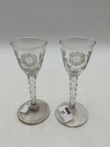 A pair of flower engraved wine glasses with facetted stems, probably Dutch, late 19th century 15cm