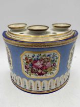 A Coalport D-shaped bough pot and cover, circa 1805, the powder blue ground body reserved with three