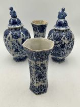 Small Delft garniture, early 20th or late 19th century comprising two flared and ribbed spill vases,