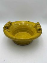 Yellow glazed pottery jardiniere with tendril handle detail. 11 x 32cm ProvenanceHarlington Manor,