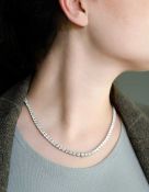A diamond line necklace,