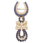 M. Gérard Ι A sapphire and diamond brooch by André Vassort Yelllow metal