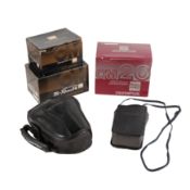 Three 35mm Cameras A Boxed Olympus OM20 Outfit and two Others