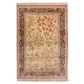 An extremely fine silk Qum rug, central Persia