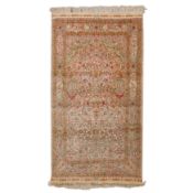 An extremely fine silk prayer rug woven in Hereke style