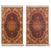 A pair of extremely fine silk Qum rugs, central Persia