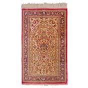 An extremely fine, signed silk Qum prayer rug, central Persia