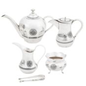 Omara circa 1936-39, signed Dakheel A cased early 20th century Iraqi silver and niello four-piece te