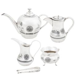 Omara circa 1936-39, signed Dakheel A cased early 20th century Iraqi silver and niello four-piece te