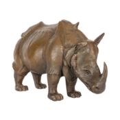 A patinated composition model of a rhinoceros 20th century