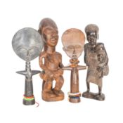 Two Ashanti akuaba dolls, a Luba-style figure and an ebony mother and child Circa 20th Century