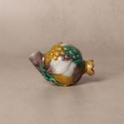 A small Chinese sancai-glazed 'pomegranate' water dropper, Qing dynasty, Kangxi period 清康熙 三彩石榴型小水滴