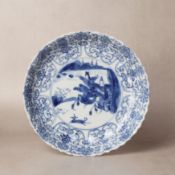 A Chinese blue and white 'hunting scene' dish, Qing dynasty, Kangxi period 清康熙 青花狩獵圖盤 《大明成化年製》款 | Sa
