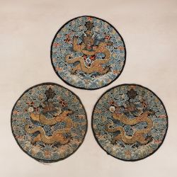Three Chinese embroidered silk 'dragon' roundels, Qing dynasty, Daoguang period, 19th century 清道光 十九