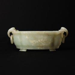 A Chinese celadon jade 'floral' marriage bowl, Qing dynasty, 19th century 清十九世紀 青玉花卉紋活環洗