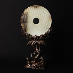 A fine Chinese celadon and russet jade disc, bi, Western Han dynasty 西漢 青玉帶皮璧