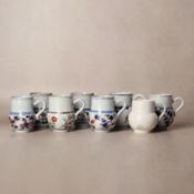 A group of Chinese export Imari 'floral' mugs, Qing dynasty, Kangxi period 清康熙 伊萬里彩繪花卉紋馬克盃一對 | Santo