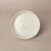 A small Chinese Qingbai 'lotus' carved dish, Southern Song dynasty 北宋 青白釉刻蓮紋盤 | Santos Collection