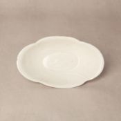 A rare Chinese Ding quatrefoil 'fish' bowl, Tang-Song dynasty 唐至宋 定窯白釉海棠式游魚紋盌