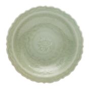 A Chinese Longquan celadon-glazed barbed dish, Ming dynasty 明 龍泉窯青釉葵口盤